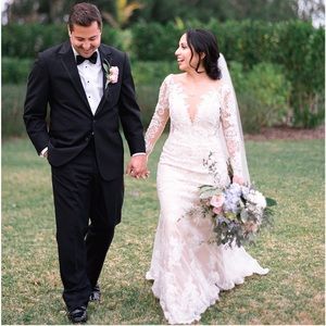 Romantic and timeless long sleeve wedding dress.